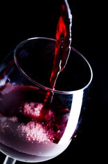 Pouring Red Wine Into Glass